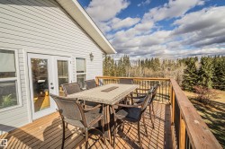 Wooden terrace featuring outdoor dining area - 