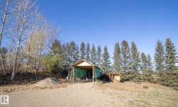 View of yard featuring an outbuilding and exterior structure - 