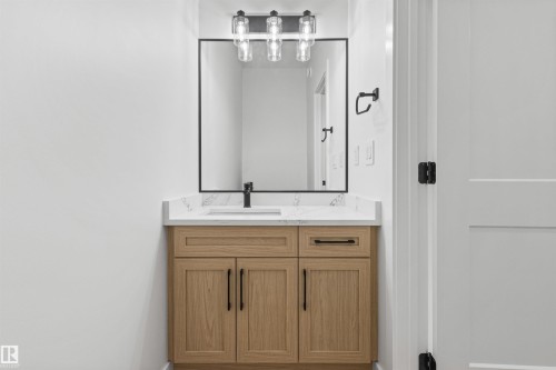 Bathroom with vanity and baseboards - 3331 Chickadee Drive, Edmonton, AB - Indoor Photo Showing Bathroom