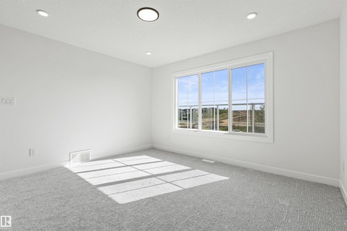 Carpeted spare room with baseboards and recessed lighting - 3331 Chickadee Drive, Edmonton, AB - Indoor Photo Showing Other Room
