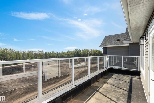 Balcony with view of scattered trees - 3331 Chickadee Drive, Edmonton, AB - Outdoor With Balcony With Exterior