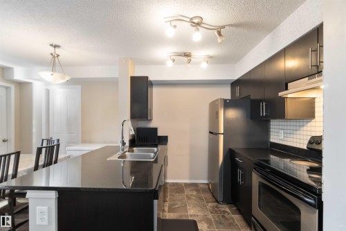 210 530 Watt Boulevard, Edmonton, AB - Indoor Photo Showing Kitchen With Stainless Steel Kitchen With Double Sink With Upgraded Kitchen