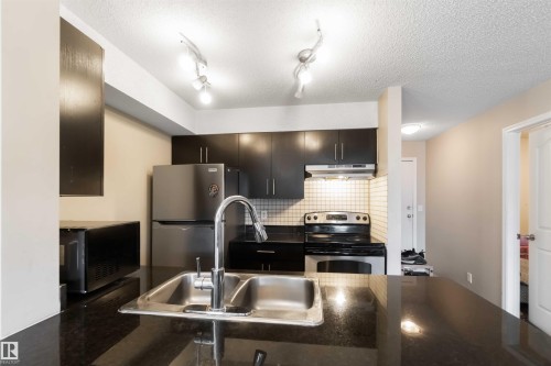 210 530 Watt Boulevard, Edmonton, AB - Indoor Photo Showing Kitchen With Stainless Steel Kitchen With Double Sink With Upgraded Kitchen