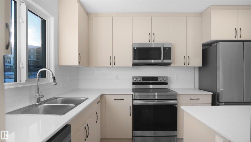 2 3705 141 Street, Edmonton, AB - Indoor Photo Showing Kitchen With Double Sink