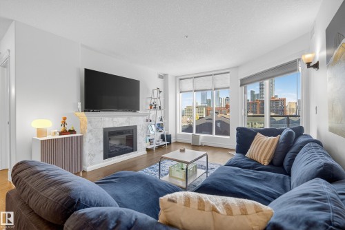 603 10142 111 Street, Edmonton, AB - Indoor Photo Showing Living Room With Fireplace