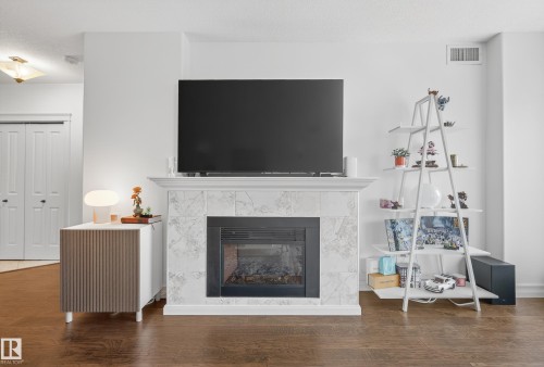 603 10142 111 Street, Edmonton, AB - Indoor Photo Showing Living Room With Fireplace