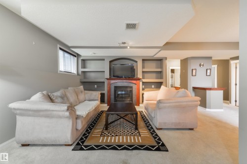 60 Huntington Crescent, Spruce Grove, AB - Indoor Photo Showing Living Room With Fireplace