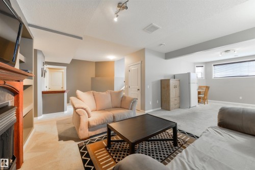 60 Huntington Crescent, Spruce Grove, AB - Indoor Photo Showing Living Room With Fireplace