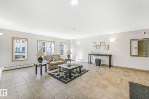 232 1406 Hodgson Way, Edmonton, AB - Indoor Photo Showing Living Room With Fireplace