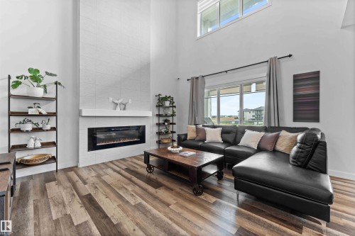 57 Dalquist Bay, Leduc, AB - Indoor Photo Showing Living Room With Fireplace