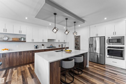 57 Dalquist Bay, Leduc, AB - Indoor Photo Showing Kitchen With Upgraded Kitchen