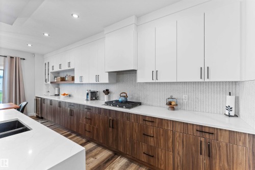 57 Dalquist Bay, Leduc, AB - Indoor Photo Showing Kitchen With Double Sink With Upgraded Kitchen