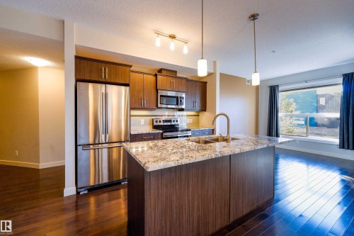 117 10523 123 Street, Edmonton, AB - Indoor Photo Showing Kitchen With Stainless Steel Kitchen With Double Sink With Upgraded Kitchen
