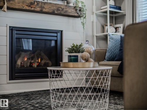 1692 Chapman Way, Edmonton, AB - Indoor Photo Showing Living Room With Fireplace
