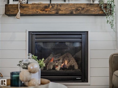 1692 Chapman Way, Edmonton, AB - Indoor Photo Showing Living Room With Fireplace