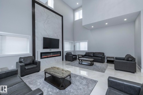 14 3466 Keswick Boulevard, Edmonton, AB - Indoor Photo Showing Living Room With Fireplace