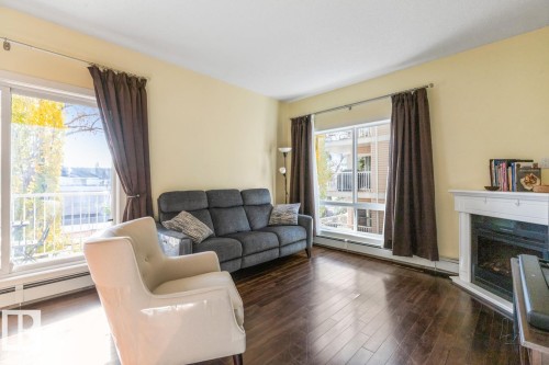 202 10524 77 Avenue, Edmonton, AB - Indoor Photo Showing Living Room With Fireplace