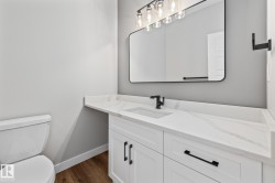 Bathroom featuring vanity and dark wood-type flooring - 