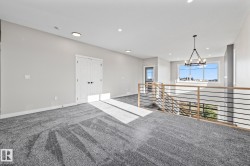 Unfurnished room with carpet flooring, recessed lighting, and a chandelier - 