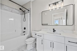 Full bathroom featuring shower / bathtub combination with curtain and vanity - 