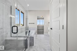 Full bathroom with a bath and a marble finish shower - 