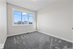 Carpeted empty room featuring baseboards - 