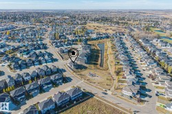 Aerial view of property's location featuring nearby suburban area - 