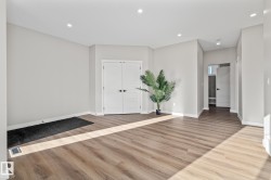 Foyer with recessed lighting and light wood-style floors - 