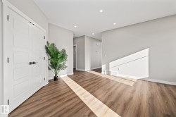 Foyer entrance featuring wood finished floors and recessed lighting - 