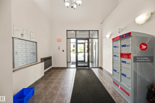 Common area featuring heating unit and a high ceiling - 2209 7343 South Terwillegar Drive, Edmonton, AB - Indoor Photo Showing Other Room