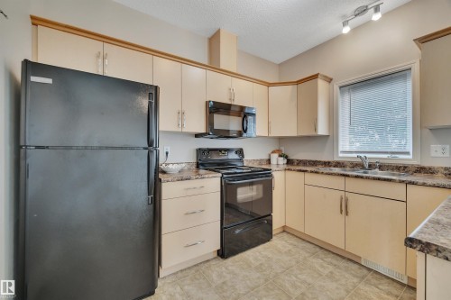 2 5102 30 Avenue, Beaumont, AB - Indoor Photo Showing Kitchen With Double Sink