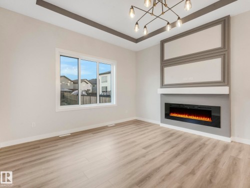 36 Dalquist Bay, Leduc, AB - Indoor Photo Showing Living Room With Fireplace