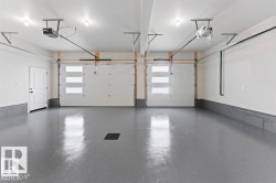 Garage featuring a garage door opener - 