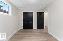 Unfurnished bedroom featuring light wood finished floors and a closet - 