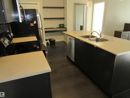 #234 504 Albany Way, Edmonton, AB - Indoor Photo Showing Kitchen With Double Sink