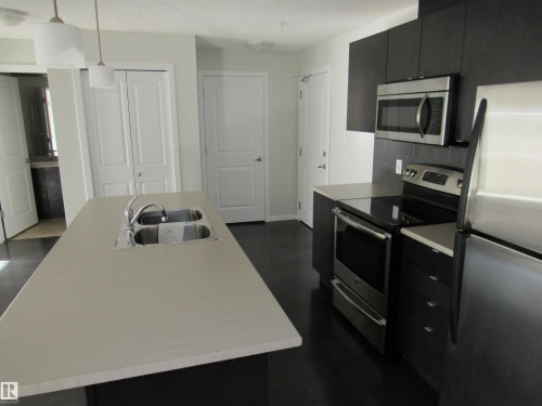 #234 504 Albany Way, Edmonton, AB - Indoor Photo Showing Kitchen With Double Sink