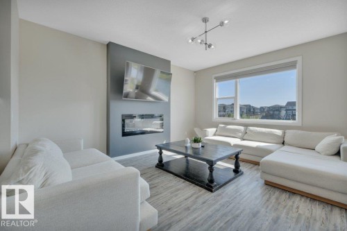 2320 Chokecherry Close, Edmonton, AB - Indoor Photo Showing Living Room With Fireplace