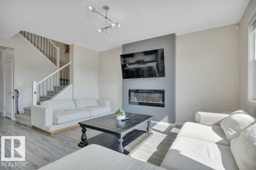 2320 Chokecherry Close, Edmonton, AB - Indoor Photo Showing Living Room With Fireplace