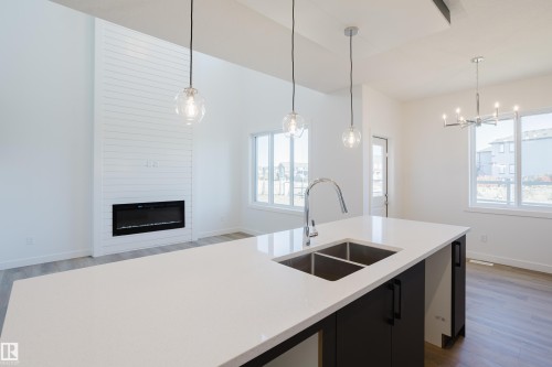132 Mitchell Bend, Leduc, AB - Indoor Photo Showing Kitchen With Double Sink With Upgraded Kitchen
