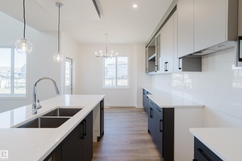 132 Mitchell Bend, Leduc, AB - Indoor Photo Showing Kitchen With Double Sink With Upgraded Kitchen