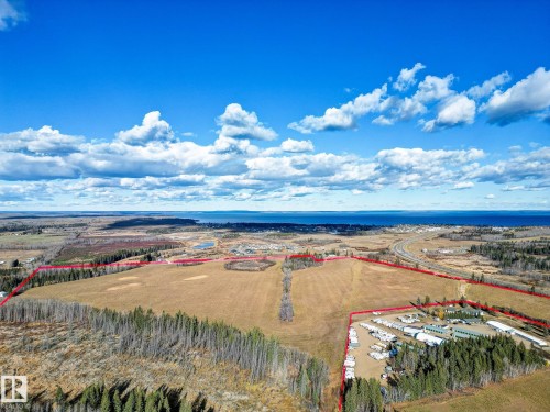 Aerial overview of property's location with property parcel outlined and a nearby body of water - Highway  55 8 Avenue, Cold Lake, AB 