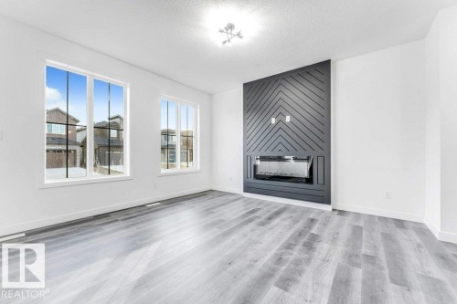 22 Westwyck Link, Spruce Grove, AB - Indoor Photo Showing Living Room With Fireplace