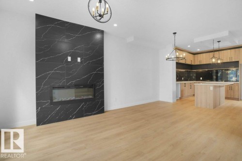 10946 62 Avenue, Edmonton, AB - Indoor Photo Showing Kitchen With Fireplace