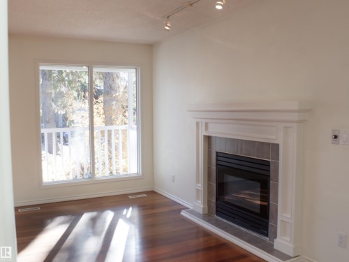 9130 77 Avenue, Edmonton, AB - Indoor Photo Showing Living Room With Fireplace