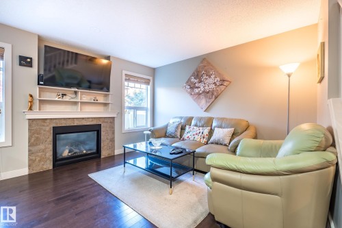 1692 Cunningham Way, Edmonton, AB - Indoor Photo Showing Living Room With Fireplace
