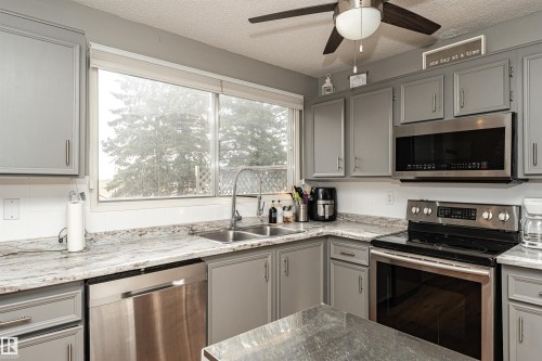 10703 95 Avenue, Morinville, AB - Indoor Photo Showing Kitchen With Double Sink