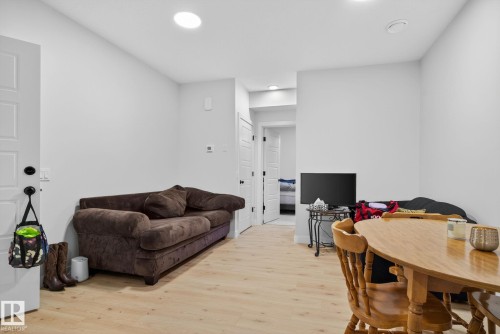 Living area with light wood-style flooring and recessed lighting - 382 Crystallina Nera Drive, Edmonton, AB - Indoor
