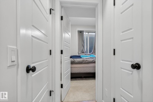 Corridor featuring light colored carpet - 382 Crystallina Nera Drive, Edmonton, AB - Indoor Photo Showing Other Room