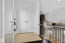 Entryway featuring light wood-style flooring and baseboards - 382 Crystallina Nera Drive, Edmonton, AB  - Indoor Photo Showing Other Room 
