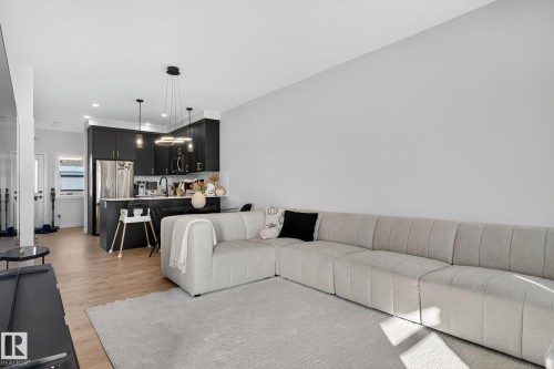 Living area featuring light wood-style flooring and recessed lighting - 382 Crystallina Nera Drive, Edmonton, AB - Indoor Photo Showing Living Room